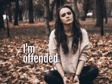 offended girl sitting on the ground