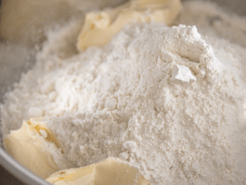 Dry flour and chucks of butter in bowl