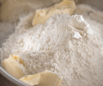 Dry flour and chucks of butter in bowl