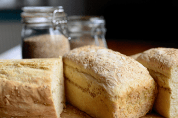 Loaves of fresh-baked bread on a board