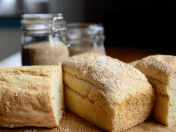 Loaves of fresh-baked bread on a board