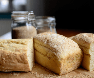 Loaves of fresh-baked bread on a board