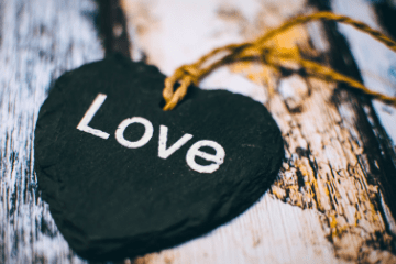 black wooden heart on a string