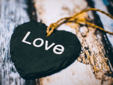 black wooden heart on a string