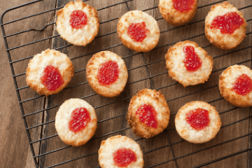 Jam Christmas cookies on a cooking rack