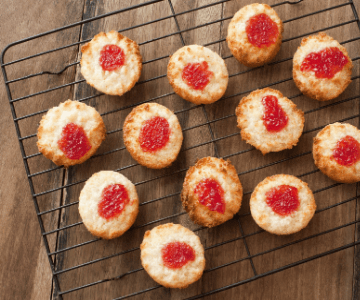 Jam Christmas cookies on a cooking rack